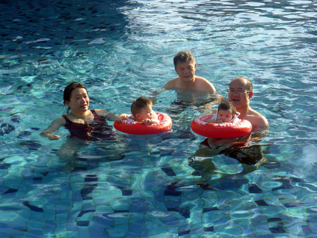 Miaomiao, Max and Miaomiao`s family at the swimming pool of the Guantang Hot Spring Resort