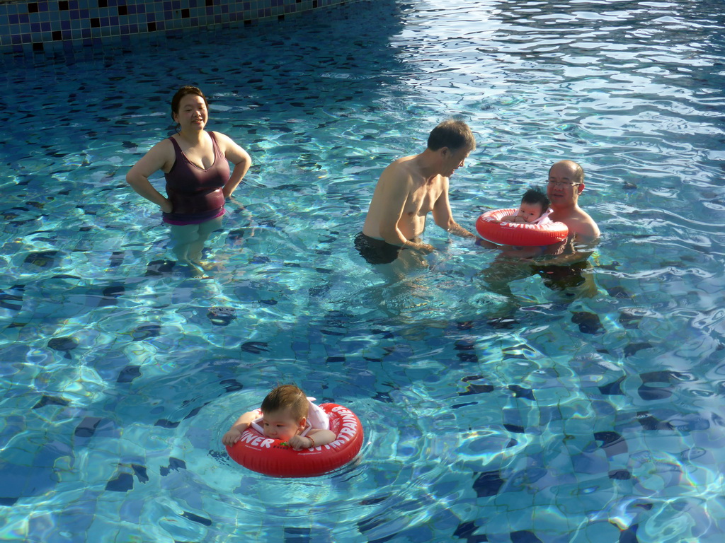 Miaomiao, Max and Miaomiao`s family at the swimming pool of the Guantang Hot Spring Resort