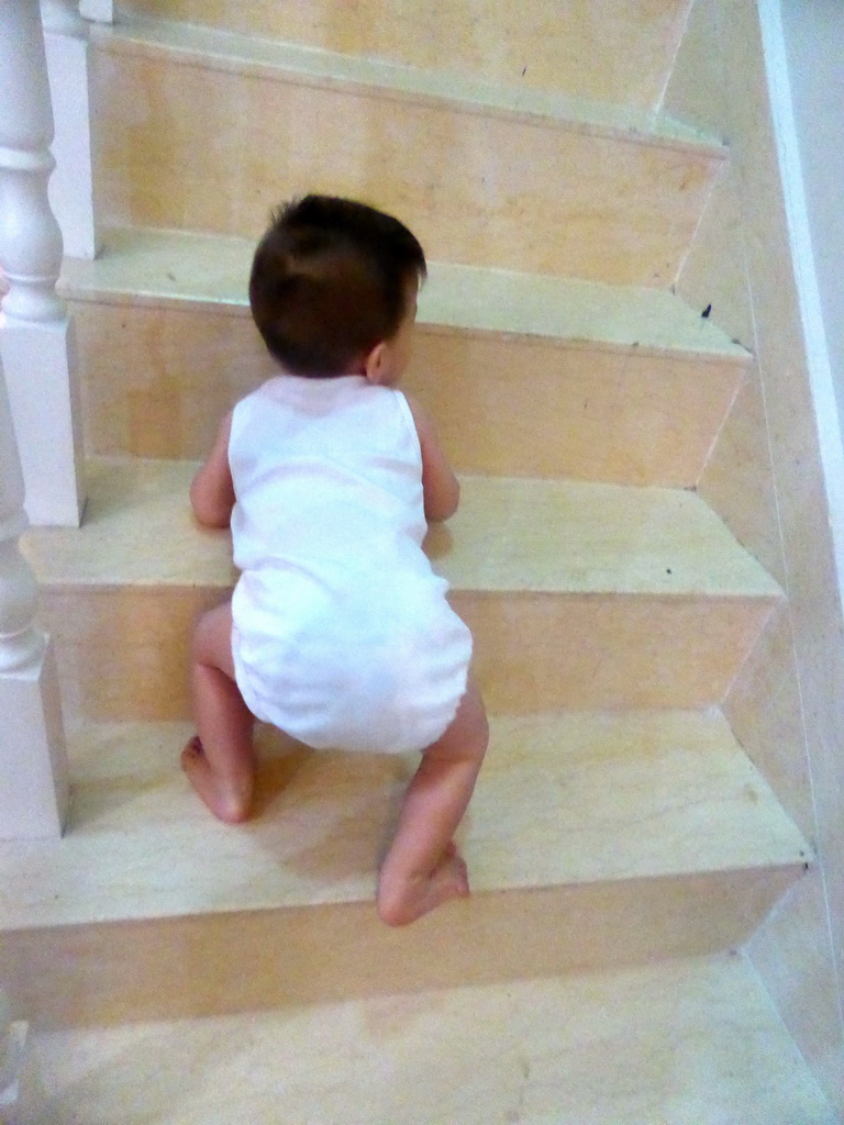 Max on the staircase of the room of Miaomiao`s family at the Guantang Hot Spring Resort