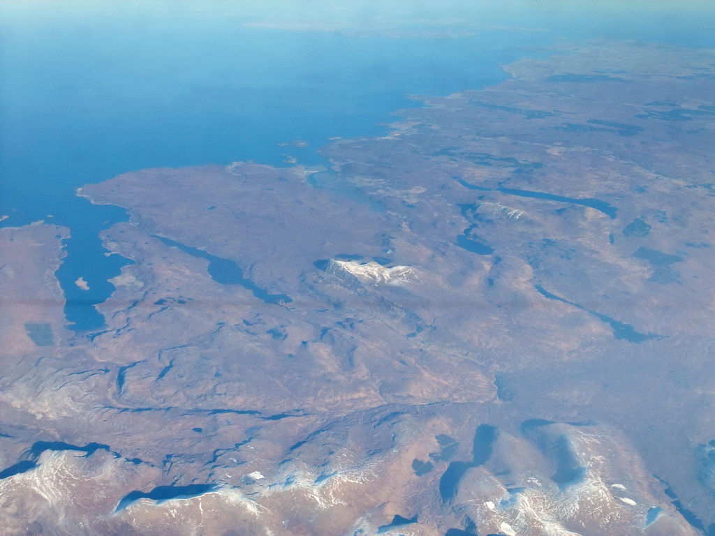Lochs and mountains at the northwest coast of Scotland, viewed from the plane from Amsterdam