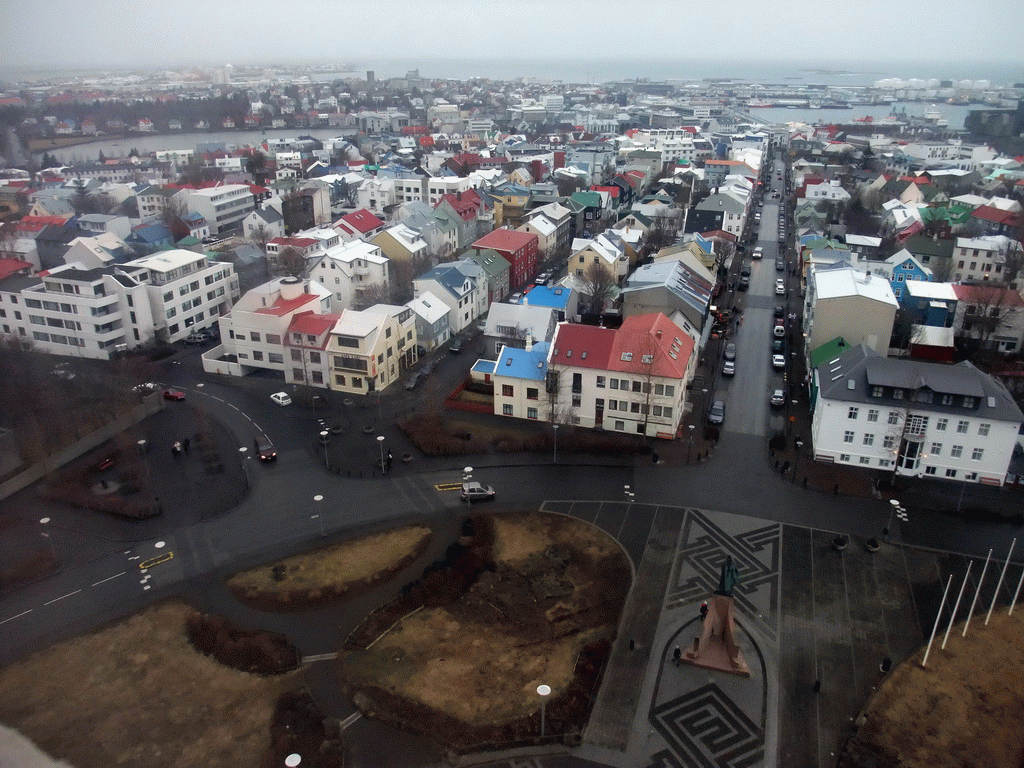 The statue of Leif Ericson at the Eriksgata street and the west side of the city with the Tjörnin lake, viewed from the tower of the Hallgrímskirkja church