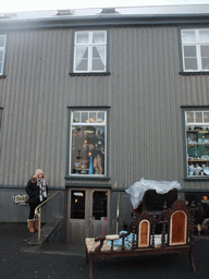 Miaomiao with sofa and chairs in front of the Friða Frænka Boutique at Vesturgata street
