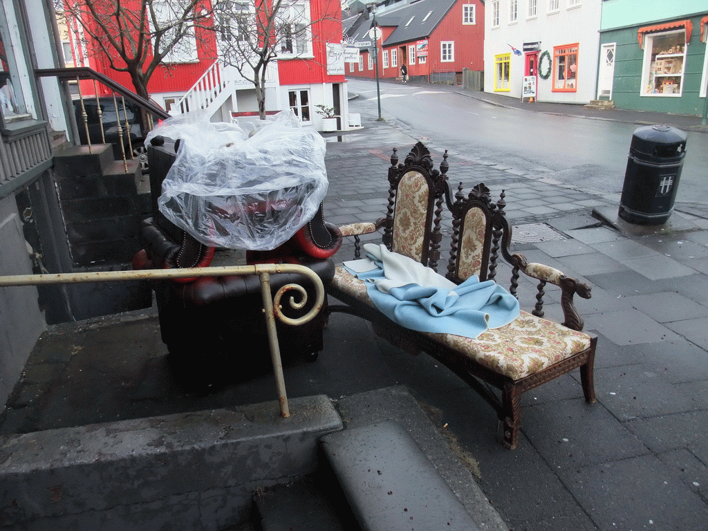 Sofa and chairs in front of the Friða Frænka Boutique at Vesturgata street