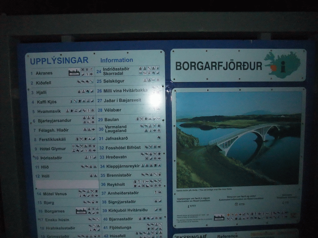 Information on the Borgarfjörður fjord at a parking place during the Northern Lights Tour, by night