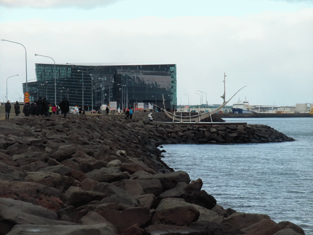 The Harpa Concert Hall and the sculpture `The Sun Voyager` at the Sculpture and Shore Walk