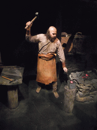 Wax statue of a blacksmith, at the Saga Museum in the Perlan building