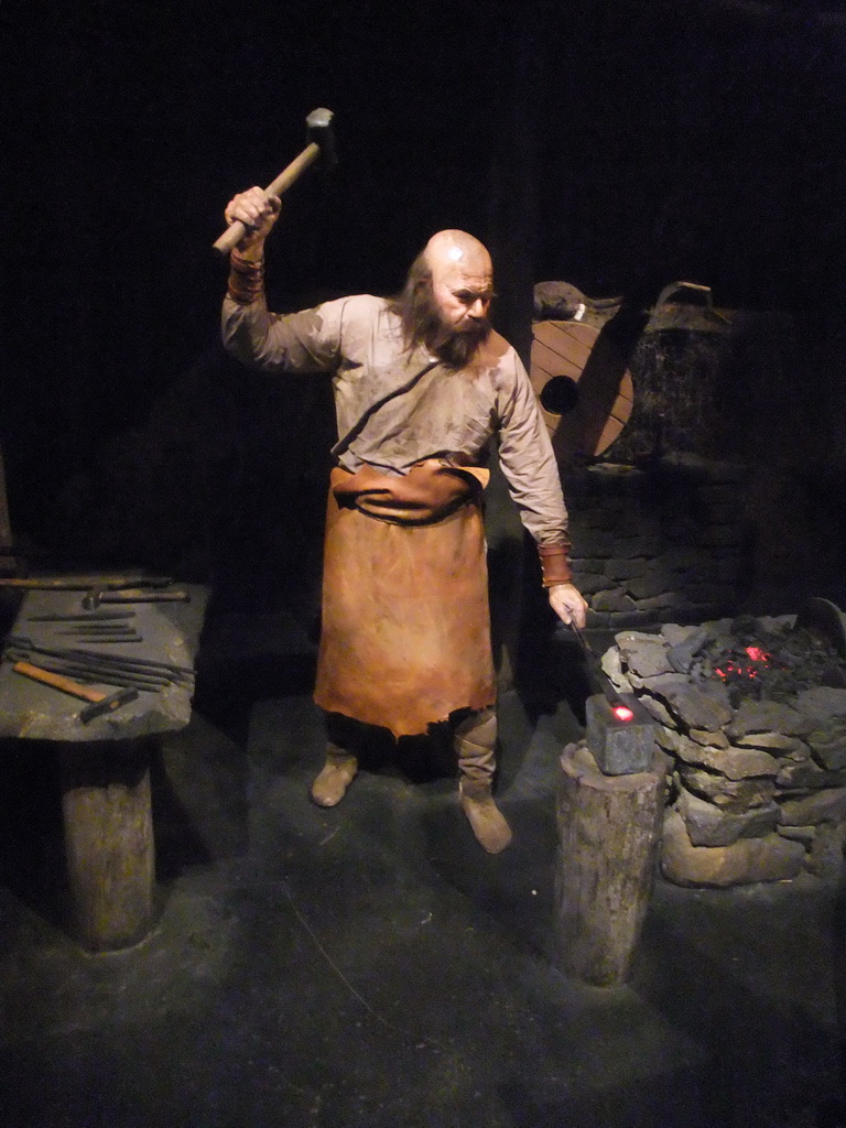 Wax statue of a blacksmith, at the Saga Museum in the Perlan building