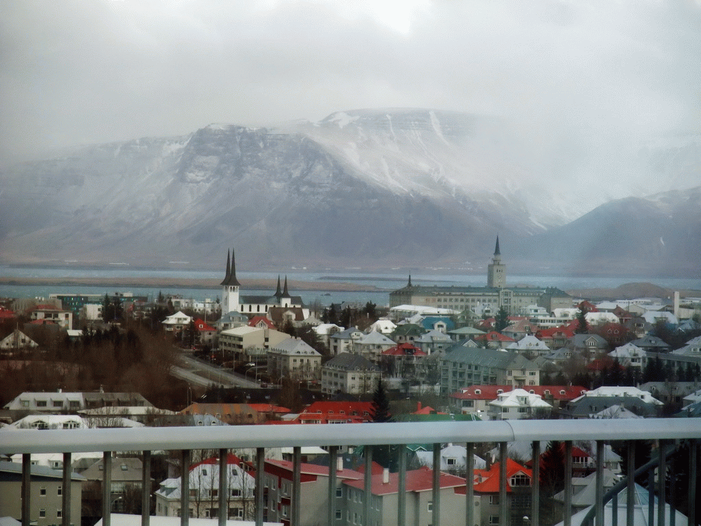 The city center with the towers of the Háteigskirkja church and the Tækniskólinn school and Mount Esja, viewed from the roof of the Perlan building
