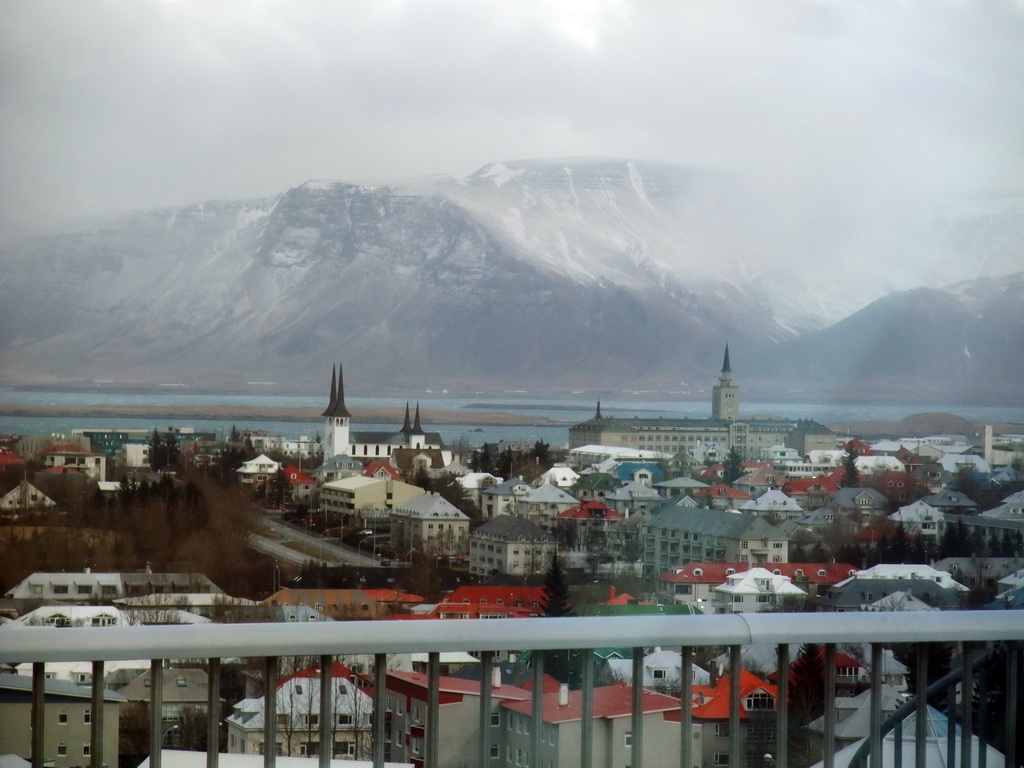The city center with the towers of the Háteigskirkja church and the Tækniskólinn school and Mount Esja, viewed from the roof of the Perlan building