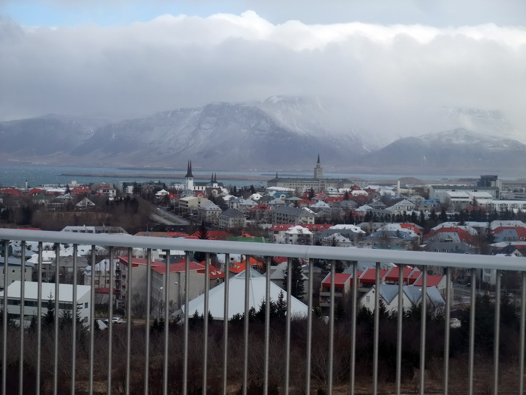 The city center with the towers of the Háteigskirkja church and the Tækniskólinn school and Mount Esja, viewed from the roof of the Perlan building