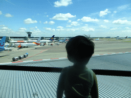 Max looking at airplanes at Schiphol Airport