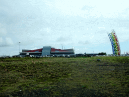 Keflavik International Airport and a piece of art, viewed from the rental car on the Reykjanesbraut road