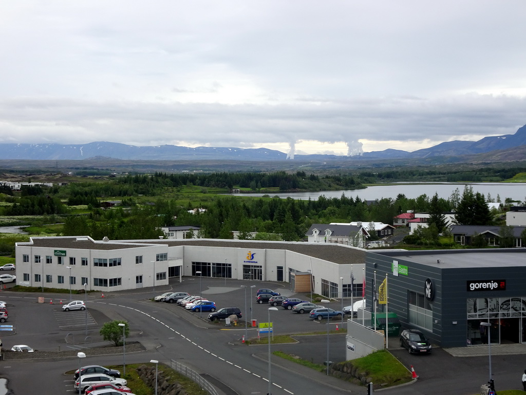 The east side of Kópavogur, the Elliðavatn lake, the Heiðmörk park, mountains and smoke from the Hellisheiði Power Station, viewed from the balcony of our apartment at the Icelandic Apartments