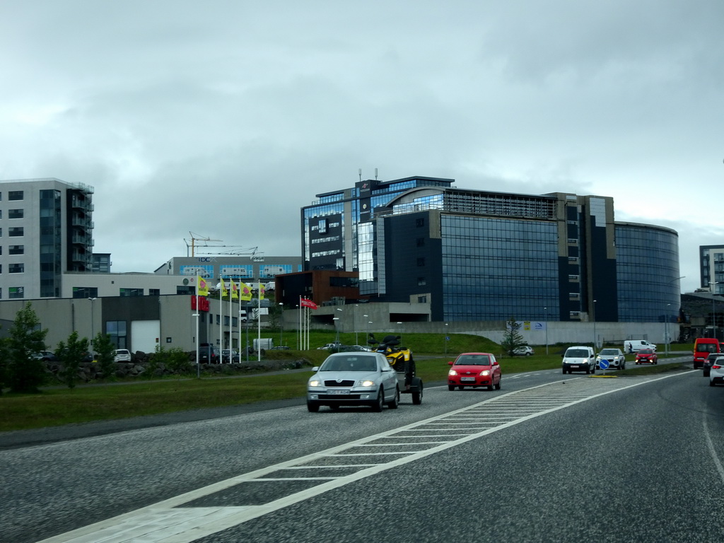 The Icelandic Apartments building and other buildings, viewed from the rental car on the 413 road