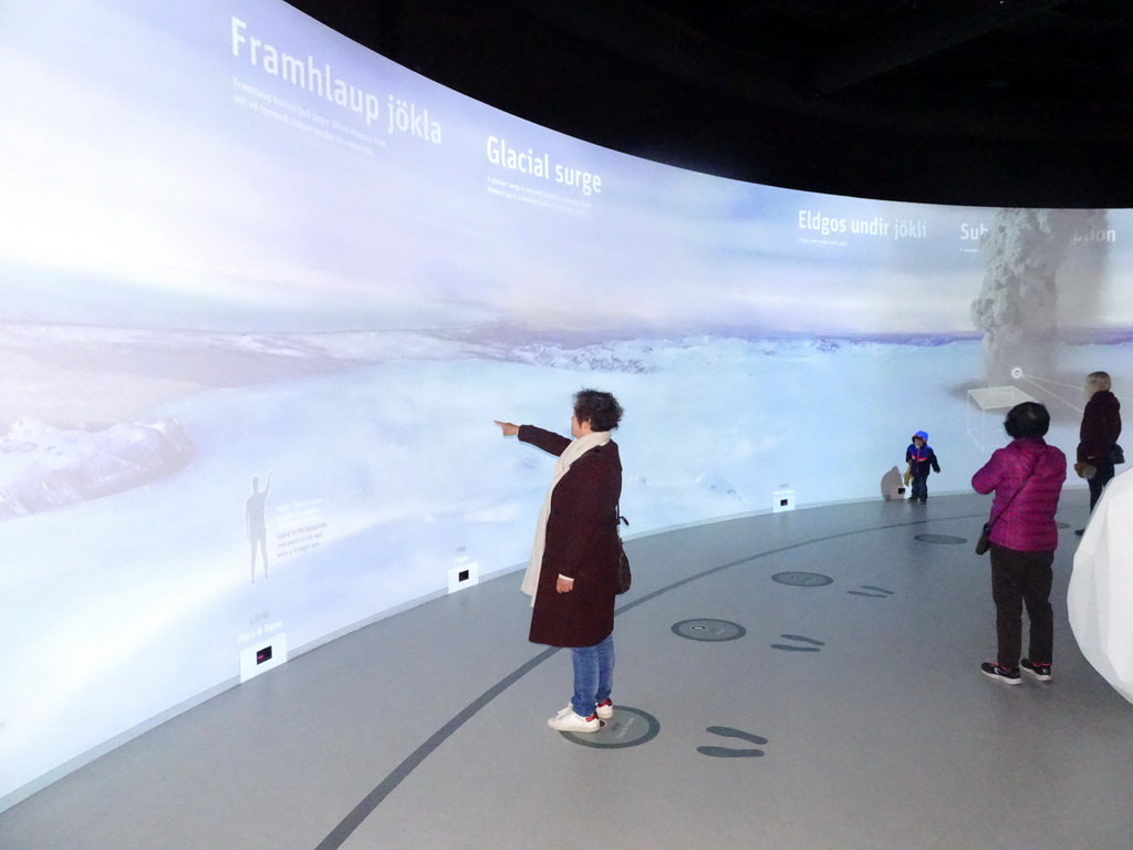 Miaomiao, Max and Miaomiao`s mother at the interactive wall at the Glaciers Exhibit at the Wonders of Iceland exhibition at the Second Floor of the Perlan building