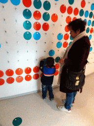 Miaomiao and Max at the message wall at the Glaciers Exhibit at the Wonders of Iceland exhibition at the Second Floor of the Perlan building