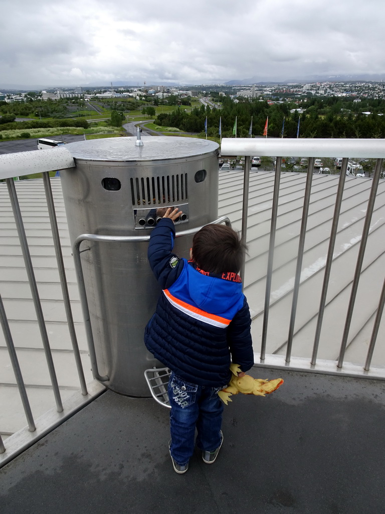 Max on the roof of the Perlan building, with a view on the east side of the city