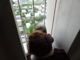 Miaomiao and Max at the tower of the Hallgrímskirkja church, with a view on the southwest side of the city