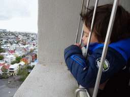 Max at the tower of the Hallgrímskirkja church, with a view on the northwest side of the city with Café Loki