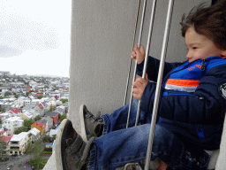 Max at the tower of the Hallgrímskirkja church, with a view on the northwest side of the city with Café Loki