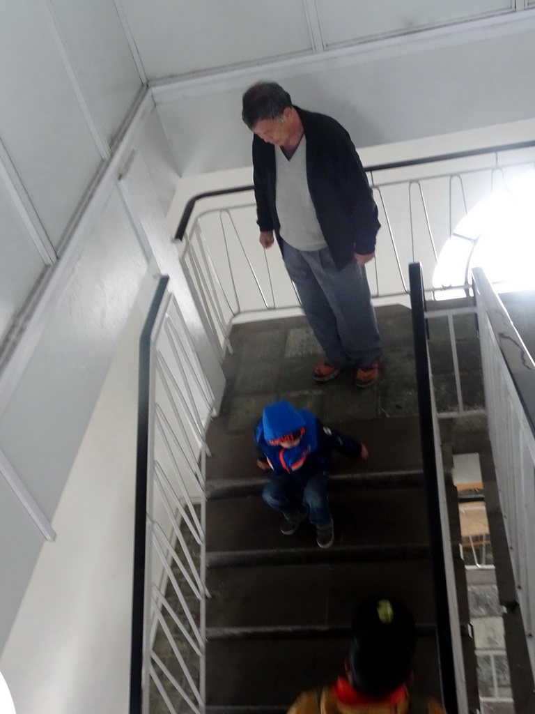 Max and Miaomiao`s father on the staircase in the tower of the Hallgrímskirkja church