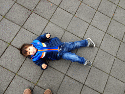 Max laying on the floor in front of the Hallgrímskirkja church