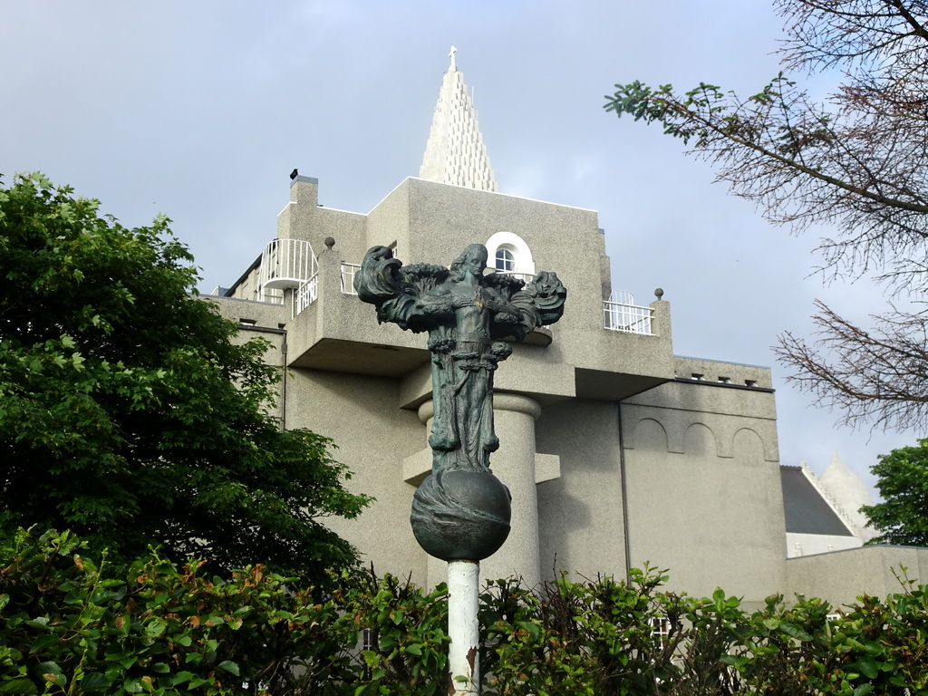 Sculpture at the Einar Jónsson Sculpture Garden, the back side of the Einar Jónsson Museum and the tower of the Hallgrímskirkja church