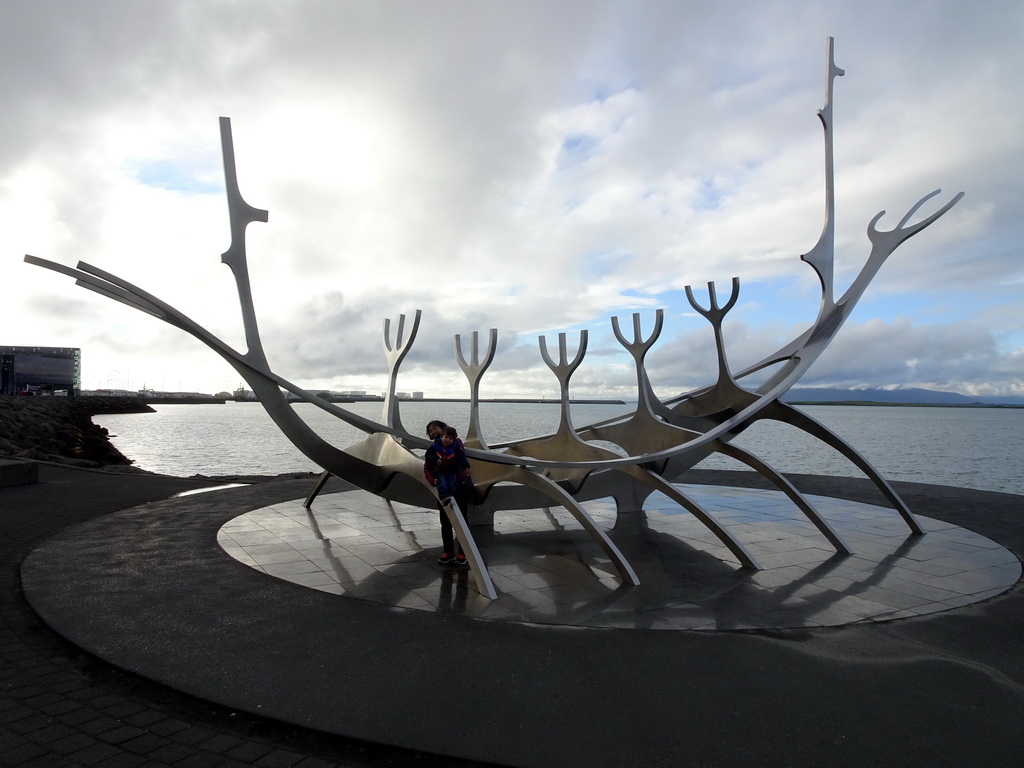 Max and Miaomiao`s mother at the sculpture `The Sun Voyager` at the Sculpture and Shore Walk