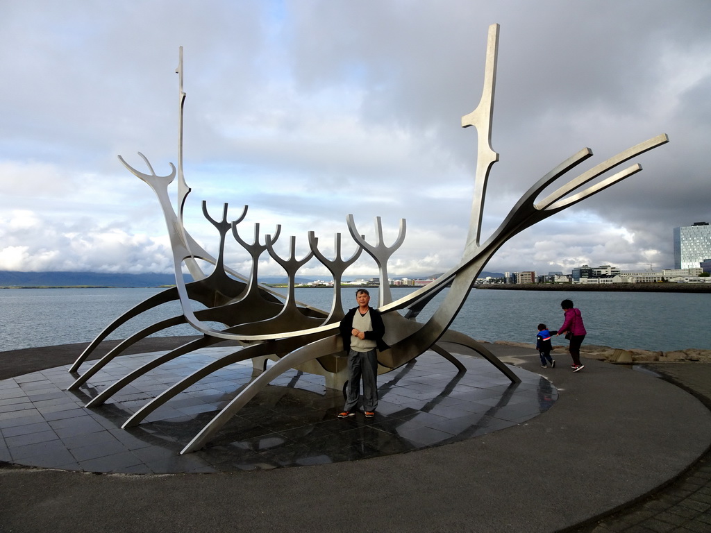Max and Miaomiao`s parents at the sculpture `The Sun Voyager` at the Sculpture and Shore Walk