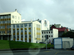 The Hverfisgallerí building at the Hverfisgata street, viewed from the rental car on the Kalkofnsvegur street