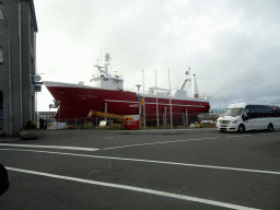 Large ship in the Reykjavik harbour, viewed from the rental car on the Geirsgata street