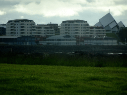 Apartment buildings and the Seltjarnarneskirkja church, viewed from the rental car on the Eiðsgrandi street