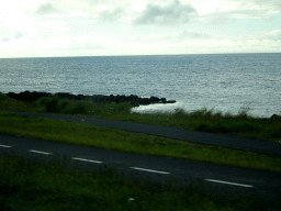The Göngustígur path along the shore, viewed from the rental car on the Norðurströnd street