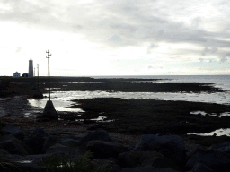 The northern shore of Grótta Island with the Grótta Island Lighthouse, viewed from the parking lot at the west end of the Norðurströnd street