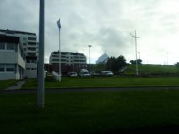 Apartment buildings and the Seltjarnarneskirkja church, viewed from the rental car on the Norðurströnd street