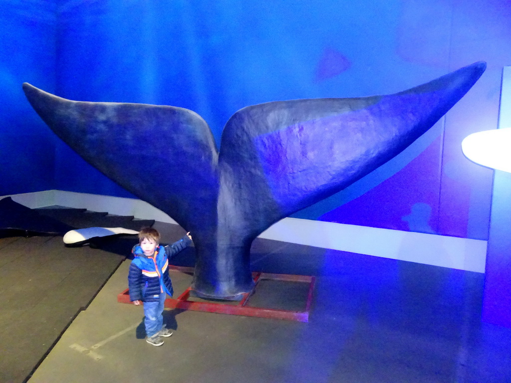 Max with a statue of a Whale`s tail at the Whales of Iceland exhibition
