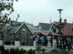 The Islandia Tourist Shop and the Lækjarbrekka restaurant at the Bankastræti street, viewed from the rental car on the Lækjargata street