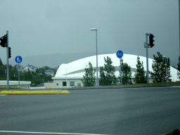 The Laugardalshöll sport center, viewed from the rental car on the Suðurlandsbraut street