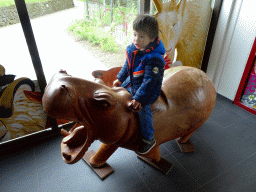 Max on a statue of a Hippopotamus at the Entrance Building of the Húsdýragarðurinn zoo
