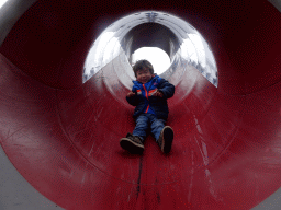 Max at the slide at the playground at the Fjölskyldugarðurinn park