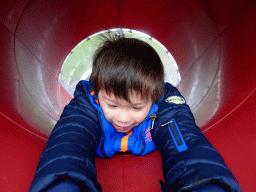 Max at the slide at the playground at the Fjölskyldugarðurinn park
