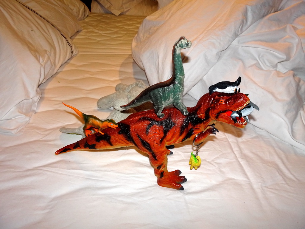 Dinosaur toys on the bed of our apartment at the Icelandic Apartments at Kópavogur