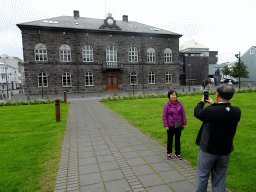 Miaomiao`s parents in front of the Alþingi parliament house at the Kirkjustræti street