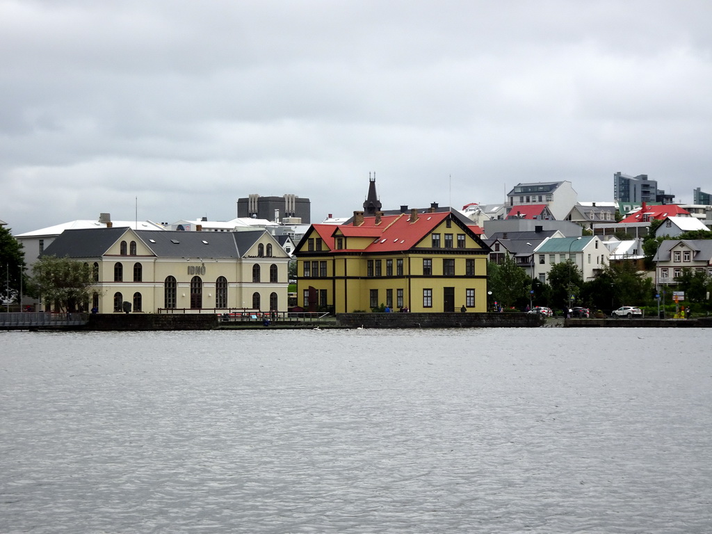 The northeast side of the Tjörnin lake with the Iðnó restaurant, viewed from the Tjarnargata street
