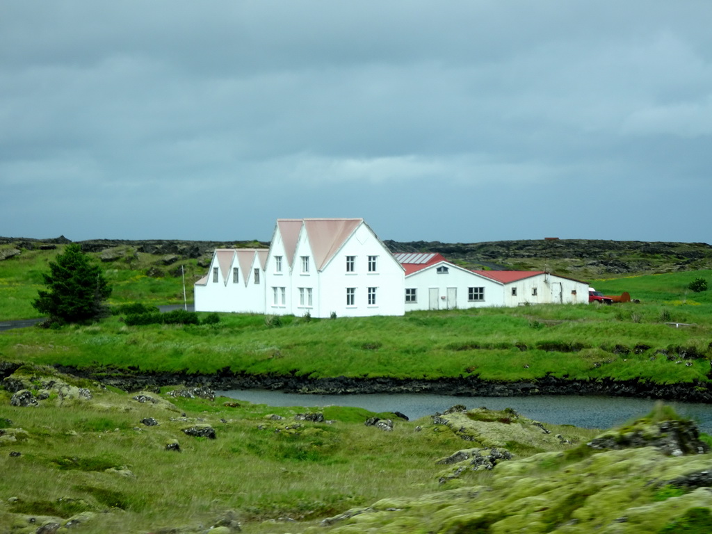 Houses west of Hafnarfjörður, viewed from the rental car on the Reykjanesbraut road