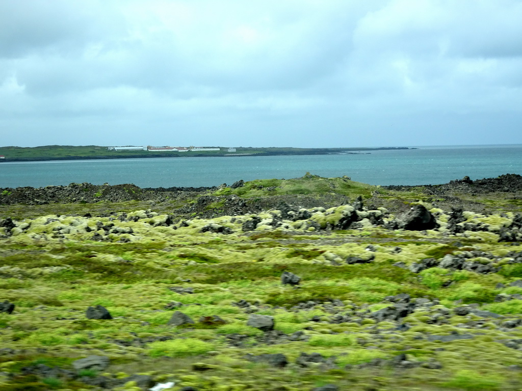The town of Flekkurvík, viewed from the rental car on the Reykjanesbraut road
