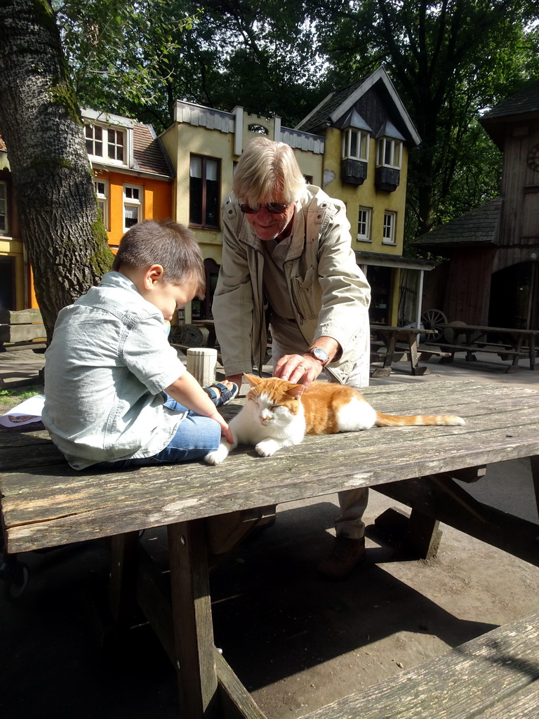 Max, Kees and a cat at the Karpatica village at the Ouwehands Dierenpark zoo