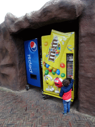 Max with a candy machine at the Ouwehands Dierenpark zoo