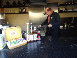 Man making Poffertjes at the Poffertjes Restaurant at the Karpatica village at the Ouwehands Dierenpark zoo