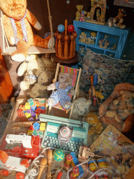 Teddy bears and their toys in the window of a house at the Karpatica village at the Ouwehands Dierenpark zoo
